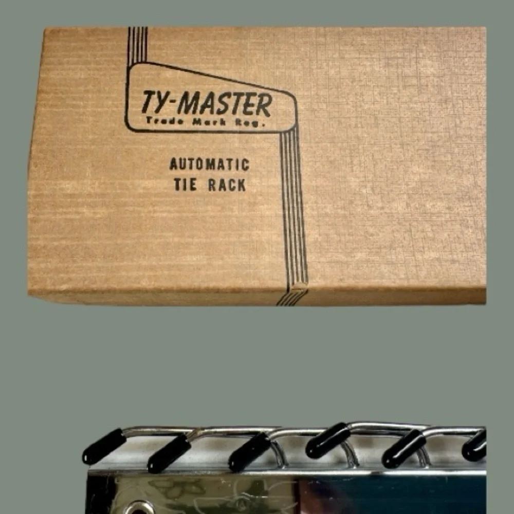 VINTAGE, TY-MASTER, AUTOMATIC TIE RACK. CHROME-PLATED. 13 3/4”W X 2 3/8”H